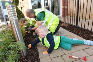 Children from Little Explorers planting the lily bulbs at The Lilies in Shrewsbury