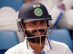Virat Kohli prepares to bat