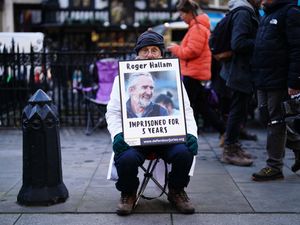 Campaigners outside the Royal Courts of Justice in London in January (Jordan Pettitt/PA)