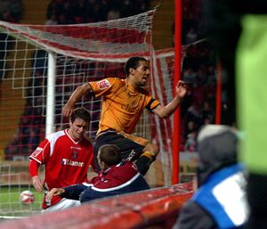 
Karl Henry jumps into the crowd to celebrate his winner.