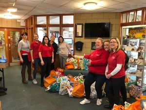 Supporting image for story: Pupils give the elderly 100 food parcels with Mufti day for donations
