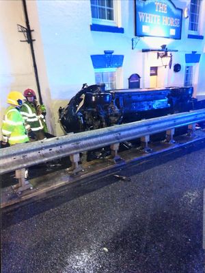 A car flipped over a barrier in a previous accident outside The White Horse pub