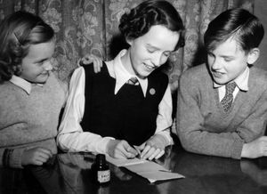 Mrs Langfield (centre) was featured in the newspaper as a child after winning a writing competition. Pictured her alongside her siblings Gaynor and Paul.