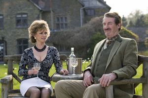 A country squire . . . John Challis with Sue Holderness in Boycie's spin-off series, The Green Green Grass