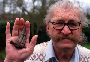 Arthur Hawkins with his souvenir of the flying bomb in 2003.