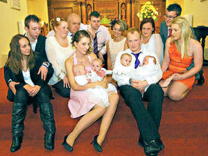 Supporting image for story: Telford quads christened in front of packed church