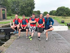 The crew takes a break with Lee Richardson, right
