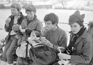 'Members of Oswestry Scout Group took part in an eight mile cross country walk on Saturday. At their lunch stop, at Carreg-y-big, are, from left, Chris Stewart, Ben Horner, Richard Barker, and Robert Jones.' January 19, 1985.