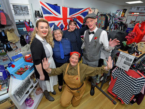 Supporting image for story: Age UK shop volunteers flies the flag for veterans with Remembrance tribute