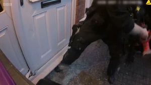 Armed police smash their way through the front door. Picture: BBC documentary Murder 24/7