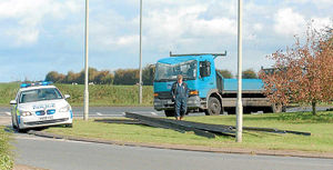 The metal girders were soon removed from the road and put on the verge