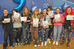 The pupils of Beacon Hill Academy celebrate their success, including Lucy Burchell, second from right