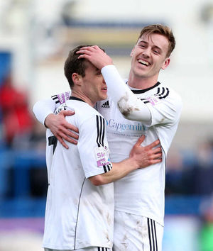 Shaun Whalley of AFC Telford United celebrates with Adam Farrell after scoring a goal to make it 3-0