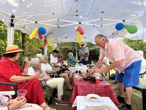 Leintwardine Social Group enjoying the protection of their new gazebo on a hot summer’s day - one of the community groups to receive a grant in 2025
