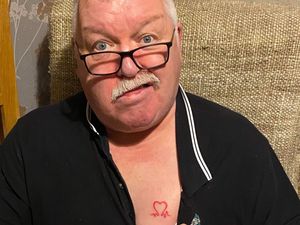 Supporting image for story: Cannock heart attack survivor keeps charity logo close to his heart as he marks 60th birthday