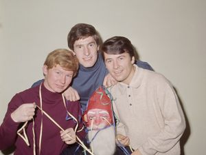 The Searchers, from left John McNally, Chris Curtis and Mike Pender, with Tony Jackson wearing a Santa Claus mask