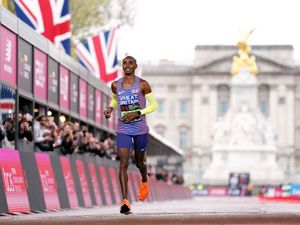Sir Mo Farah crosses the finish line in the Men’s elite race during the 2023 TCS London Marathon