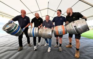 Rhys Gittins, Stuart Russell, Andy Evans, Ian Jeavons and Luke Small put the final touches together to get the festival set up. Photo: Tim Thursfield