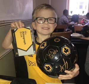 Stefan with his ball signed by the players