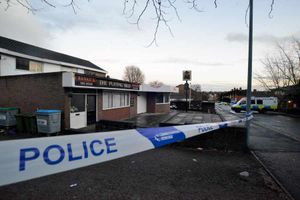The murder took place close to The Puffing Billy pub which has been cordoned off, the police tent can be seen behind the police van