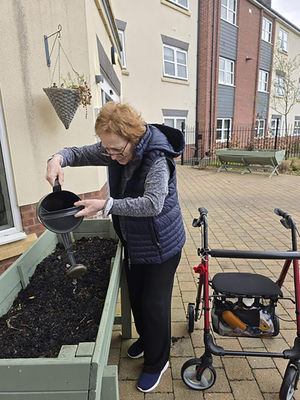 Resident Anne Cole at HC-One’s Sedgley Court Care Home gardening