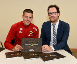 Conor Coady and Tim Spiers with the Express & Star's new book about Wolves promotion season On Our Way Back