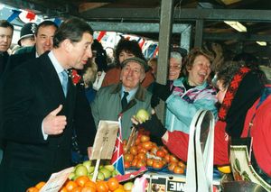 Prince Charles shares a joke with some of the people he met in Dudley Market Place during his visit in  February 1996.