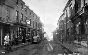 Eddie's car is parked outside his shop in this postcard showing Ironbridge High Street in the 1930s – his grandson Pete Edwards knows that because his late mother Mary told him, although he does not know which of the two cars visible is Eddie's. 