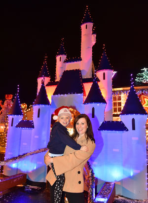 Clare McGill-Williams and daughter Lois, aged six, with the 2015 Christmas lights display at The Summerhouse in Sedgley