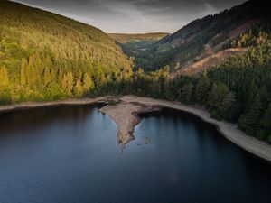 Supporting image for story: Tourists flock to Lake Vyrnwy to catch a glimpse of resurfaced 'sunken village' before it disappears again