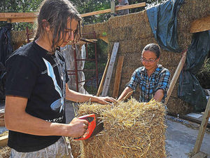 Supporting image for story: Family finally starts straw bale house