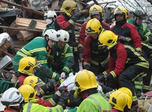 The moment the woman was rescued was captured in this image tweeted by @WestMidsFire