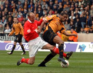 
Mikkel Bischoff is denied a goal scoring chance by John Mullin.