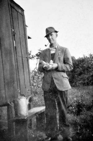 At his pigeon loft in his garden.
