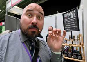 James gets a taste of flavour from one of the many hot sauce stalls