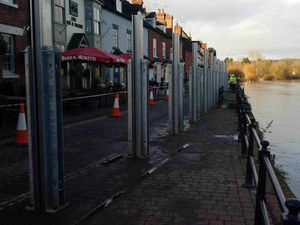 Supporting image for story: IN PICTURES: Flood defence barriers go up as residents brace themselves for Storm Eva