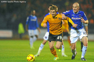 Kevin Doyle of Wolverhampton Wanderers and Sean O'Hanlon of Carlisle United.