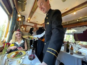 A waiter serving lunch aboard the Northern Belle