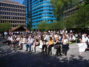 People enjoying the sunshine in Aldgate Square, London