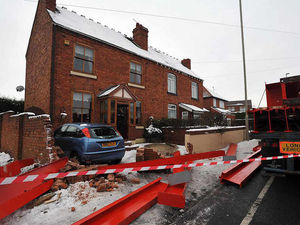 Supporting image for story: Trail of destruction as house and car hit by girders from lorry