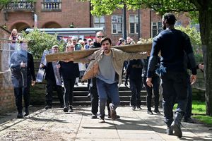 Actor playing Jesus is carrying the cross
