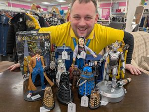Hope House charity shop volunteer Ross Dyer with some of the collectables donated at the Oswestry shop