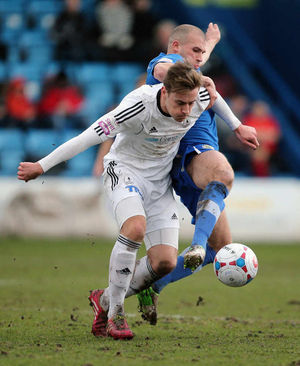 Adam Farrell of AFC Telford United and Tunji Moses of Stockport County