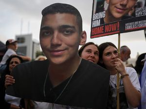 People in Tel Aviv watch a live broadcast of Israeli-American soldier Edan Alexander as he is released from Hamas captivity in Gaza