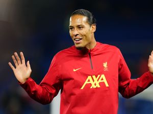 Virgil van Dijk holds up both hands