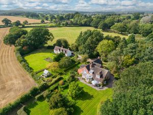 Supporting image for story: Two countryside houses with tennis court, stables and barn listed for sale at £1.5 million