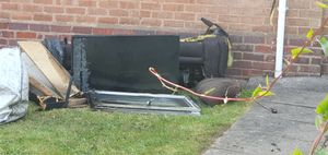 The window frame and some burnt furniture could be seen at the front of the house