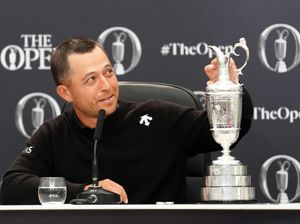 Supporting image for story: The Open: Xander Schauffele lets father Stefan take first drink from Claret Jug