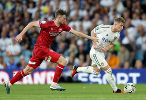 Shrewsbury Town's Joe Anderson (left) and Leeds United's Joe Gelhardt