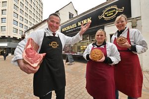 Michael Bachyk poses with Kiki Smith and Helen Bachyk outside the shop, which had operated since 1934